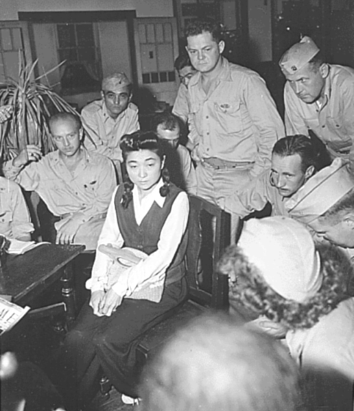 American reporters surround Iva Toguri at her September 1945 press conference in Yokohama.